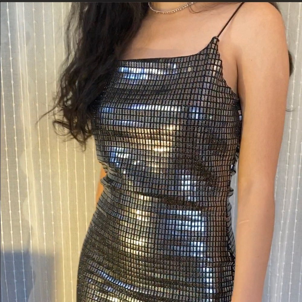 Sequined little black dress